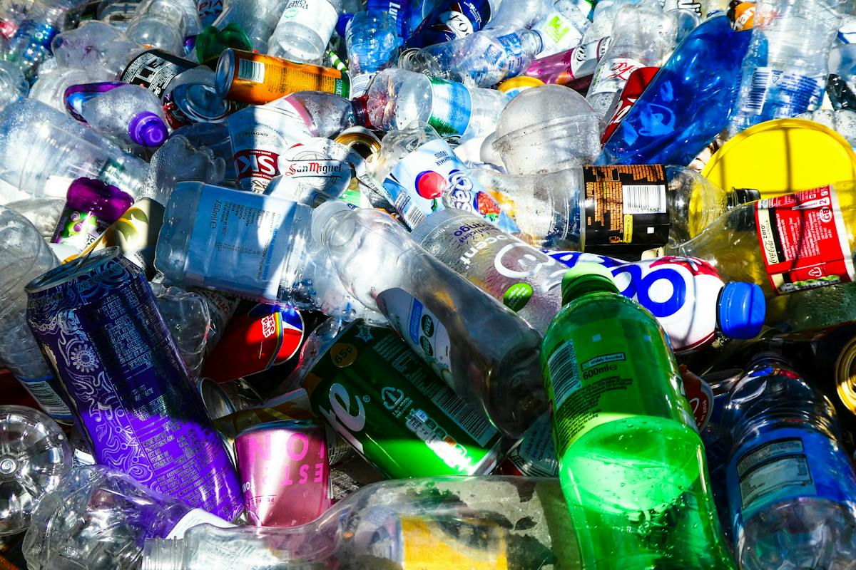 Mixed discarded plastic bottles and metal beverage cans